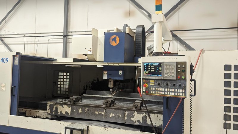 TAKUMI, V32, CNC VERTICAL MACHINING CENTRE, 10,000 RPM SPINDLE, TRAVELS (X,Y,Z): 3200 MM X 1066MM X 750 MM (126&quot; X 42&quot; X 30), DISTANCE FROM NOSE TO SPINDLE:  200MM TO 950MM, DISTANCE FROM SPINDLE NOSE TO THE Z-AXIS GUIDEWAY: 1120MM, T-SLOT TABLE SIZE: 3200MM X 1025MM (126&quot; X 40&quot;), MAX TABLE LOAD, 4500 KG (9,920 LBS), 32 TOOL ATC, TABLE SIZE: 42&quot; X 130&quot;, CAT 50, 30 KW, SPINDLE FLOOD AND THROUGH COOLANT, AIR BLAST, COOLANT FILTER SYSTEM, CHIP WASH DOWN SYSTEM, CHILLED BALL SCREW AND SPINDLE, 4-AXIS CAPABLE,  LEFT AND RIGHT CHIP CONVEYOR,  MITSUBISHI, MEDLAS 60S, CNC CONTROL, 2006, 220/3/60 50 AMP, MACHINE WEIGHT:  52.500 LBS. FLOOR SPACE (W, L, H) 295&quot; X 173&quot; X 139.7&quot; (APPROX.), S/N K0133