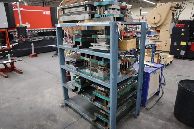 Press Dies on Steel Rack- Auction Item