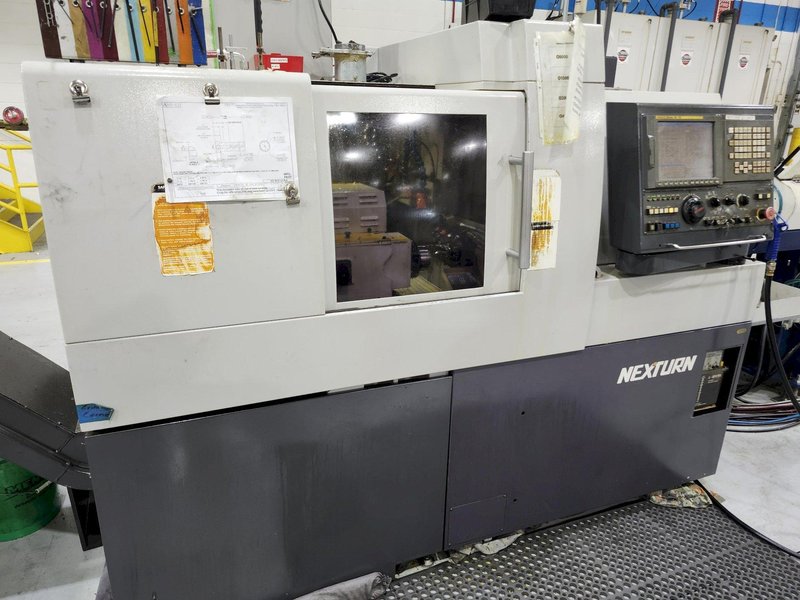 Nexturn SA-38 CNC Swiss Lathe, 38mm, 7-Axis, Turning Length: 8.3", 13 Tools, C-Axis, 8000 RPM, Fanuc 18i-TB, High Press. Coolant, Fire Suppression, Mag. Barfeeder, New 2006