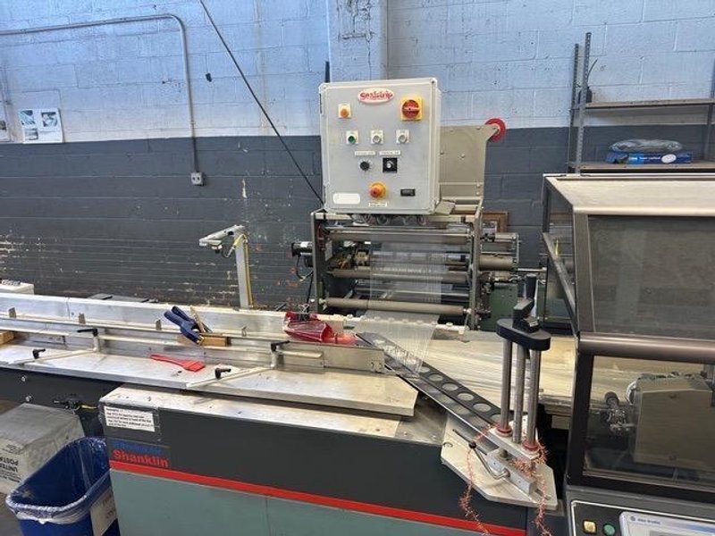 Shanklin OMNI-SLRS Shrink Wrapper with extended Lugged Infeed and T-72H Double Chamber Heat Tunnel, 2007 – Need Gone ASAP