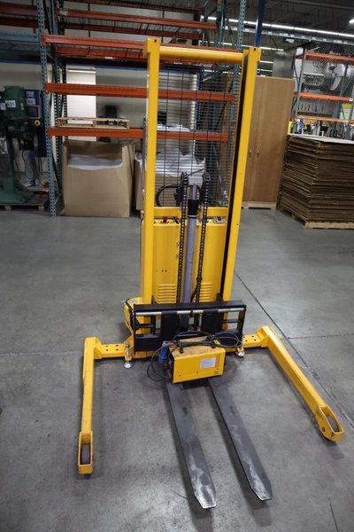 Uline H-2651 Electric Straddle Stacker Lift, 2,200# Cap, 63&quot; Max Height, 50&quot; Between Outriggers, 12 Volt Battery with Charger, 42&quot; Forks- Auction Item