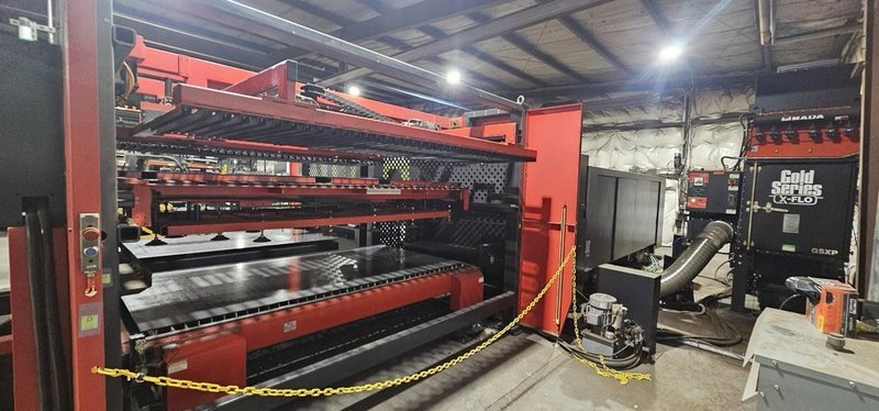 12,000 Watt Amada Regius 3015AJ Fiber Laser, 2023 – 5’x10′, Low Hours,  W/ AMS3015CL Single Pallet Automation