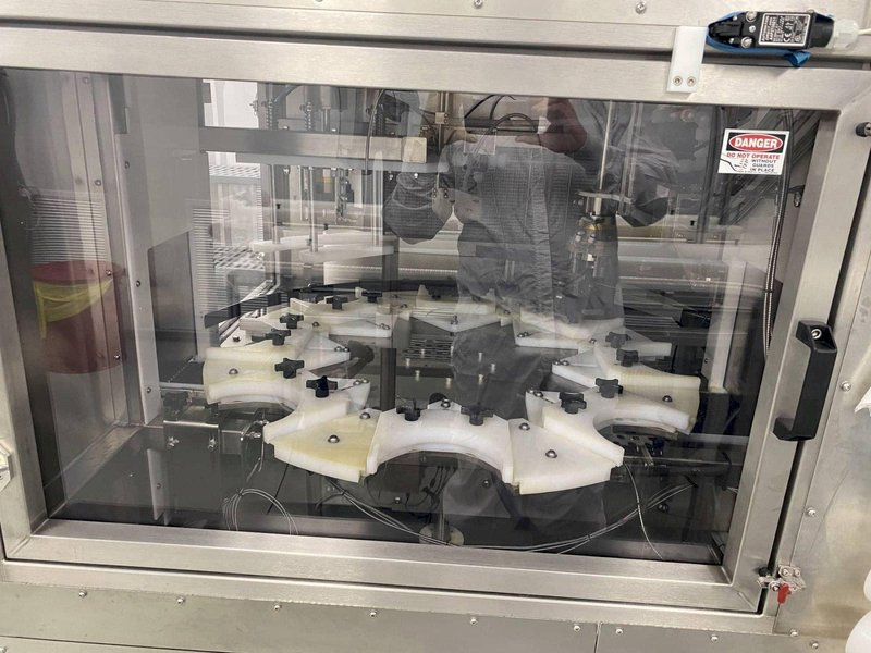 Inline Filling Systems Net-Weight Rotary Jar Filler with Integrated Capping for Clean Room Application in Semi-Conductor Industry, 2009