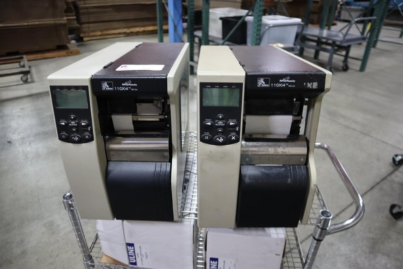 (2) Zebra 110Xi4 Label Printers, 203 dpi, 4&quot; Wide Label Cap - On Wire Cart with Labels- Auction Item