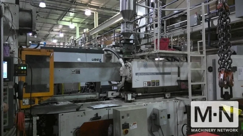 1000 TON 185 OZ UBE MODEL UM1000 INJECTION MOLDING MACHINE MFG 1999