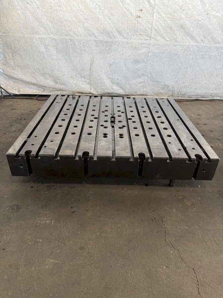 60&quot; WIDE X 67&quot; LONG X 9&quot; THICK T-SLOTTED BOLSTER PLATE. STOCK # 1006324