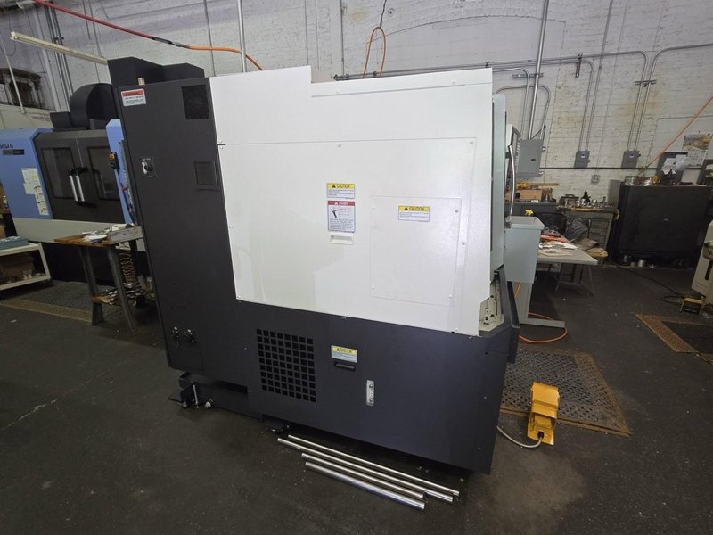 Okuma Genos L3000-e CNC Lathe, 2023 – Parts Catcher, Tailstock, Barfeed Interface