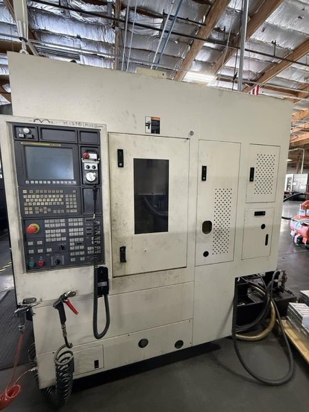 YCM NXV560A-APC VMC, 2015 – Chip Conveyor, Fanuc Control, 12K RPM