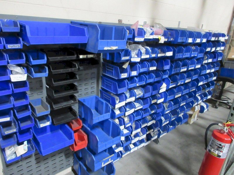 Plastic Bins Mounted to Wall with Contents of Assorted Hardware and Fasteners- Auction Item