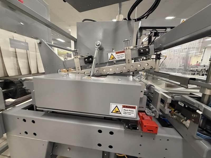 Complete Packaging Line for trays / flat Product including Custom Conveyor System, (2) Texwrap L-Bar Sealers and Heat Tunnels, Econocorp Automatic Cartoner and Case Packer and CTM Case labeler, 2023