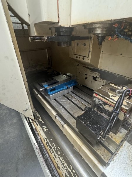 Okuma MC-V4020 VMC, 2005 – 4th Axis Rotary, Chip Conveyor