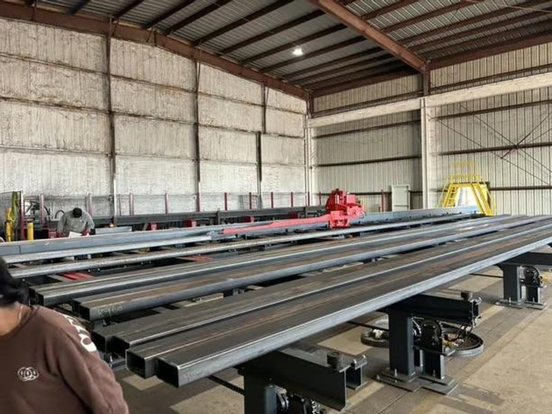 Akyapak 3ADM 1200 3-Spindle 10-Axis CNC Drilling Line, 2025 – 51″ x 23″ AST1300 Double Miter Bandsaw, Chip Conveyor, Transfer Tables