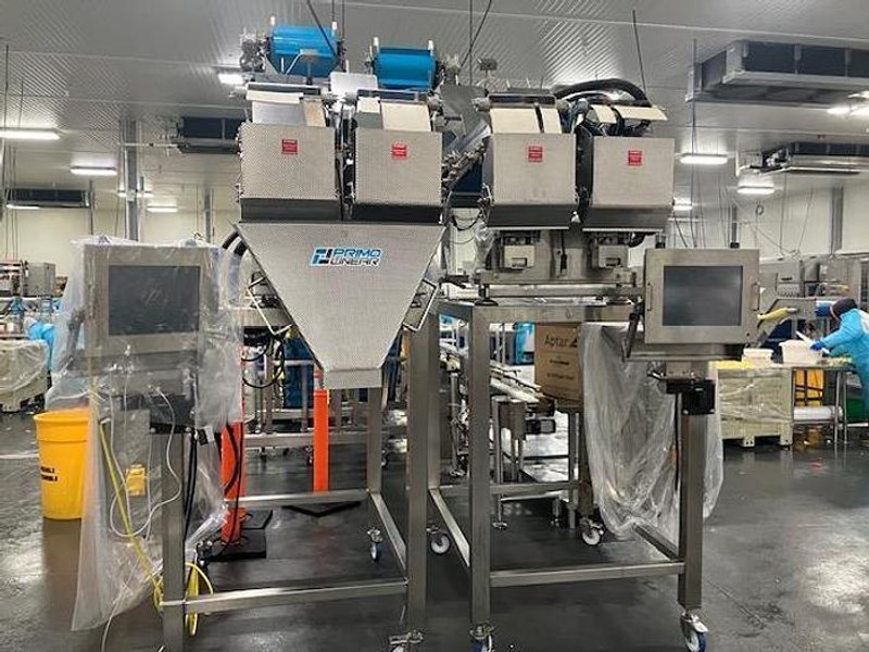 Complete System for Produce Filling Including (2) Weighpack Primolinear C-10 Two-Lane Linear Net Weighers with (2) Incline Infeed Conveyors and Floor Stands