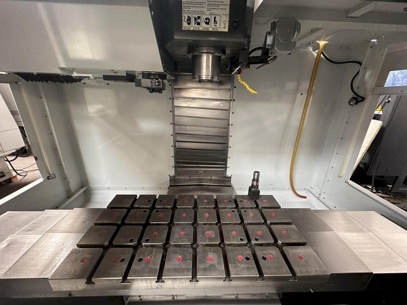 HAAS VM-2 CNC Vertical Machining Center 2011 equipped with quipped with 30"x20"x20" Travels, Haas Control, 4th Axis Drive, 24 ATC Side Mount Tool Changer, Tool Pre-Setter, Cool, Chip Auger