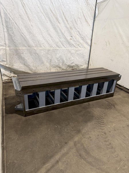 25" WIDE X 89" LONG X 24.5" TALL T-SLOTTED TABLE. STOCK # 0778825
