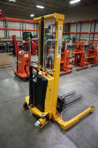 Uline H-2651 Electric Straddle Stacker Lift, 2,200# Cap, 63&quot; Max Height, 50&quot; Between Outriggers, 12 Volt Battery with Charger, 42&quot; Forks- Auction Item