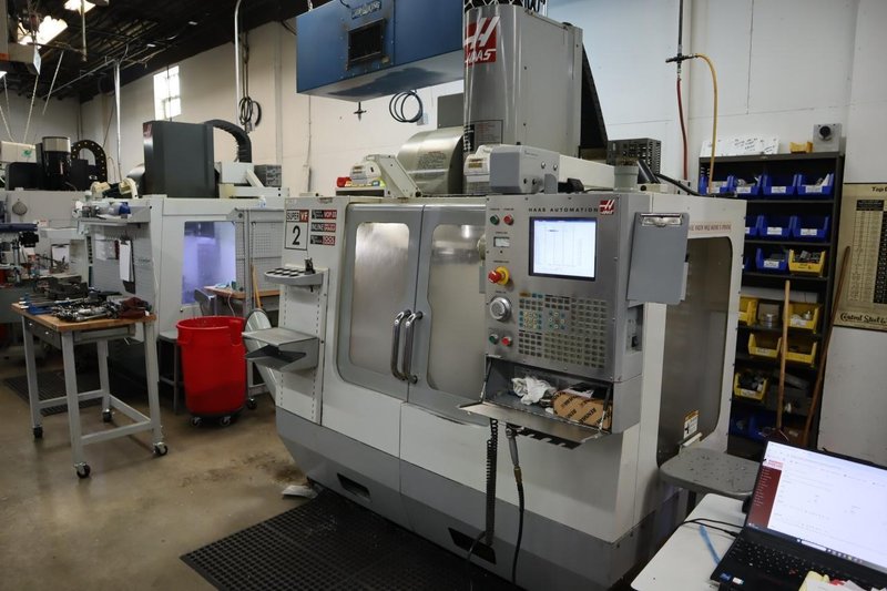 Haas VF-2SS CNC Vertical Machining Center, 12K Spindle, 4th Axis Brushless Drive with SHRT-160H Rotary Table, 24 Station SMTC, Probing, Chip Auger - Auction Item