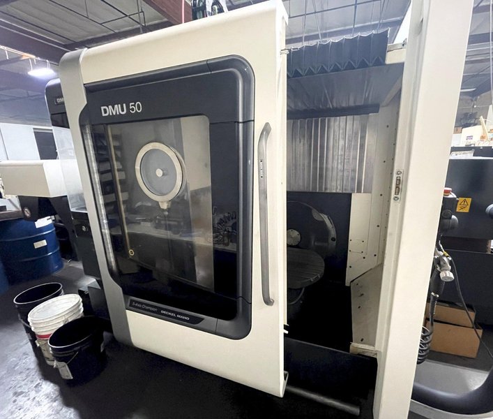 DMG DMU50 5-Axis 2015 Machining Center, Swivel Rotary, CAT40, 18,000 RPM, 60 ATC, Infrared Measuring Probe, Blum tool laser Measuring, Through Spindle Coolant, and Chip Conveyor.