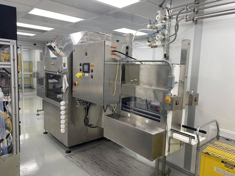 Inline Filling Systems Net-Weight Rotary Jar Filler with Integrated Capping for Clean Room Application in Semi-Conductor Industry, 2009