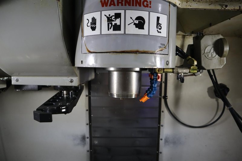 Haas VF-2SS CNC Vertical Machining Center, 12K Spindle, 4th Axis Brushless Drive with SHRT-160H Rotary Table, 24 Station SMTC, Probing, Chip Auger - Auction Item
