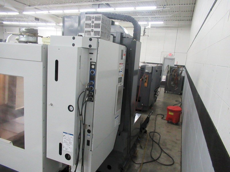 Haas VM-3 5-Axis CNC Vertical Machining Center, Haas TR-210 Trunnion, 40 Station Tool Changer, Probing, 300 PSI TSC, Chip Auger