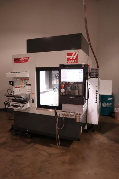Haas UMC-400SS CNC 5-Axis Vertical Machining Center, Ct40, 12K RPM, 30 ATC, Probing, 230mm Diameter Work Platter, High Speed Machining, Programmable Coolant Nozzle, Chip Auger