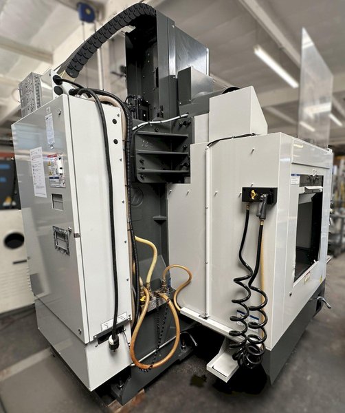 HAAS VM-2 CNC Vertical Machining Center 2011 equipped with quipped with 30"x20"x20" Travels, Haas Control, 4th Axis Drive, 24 ATC Side Mount Tool Changer, Tool Pre-Setter, Cool, Chip Auger