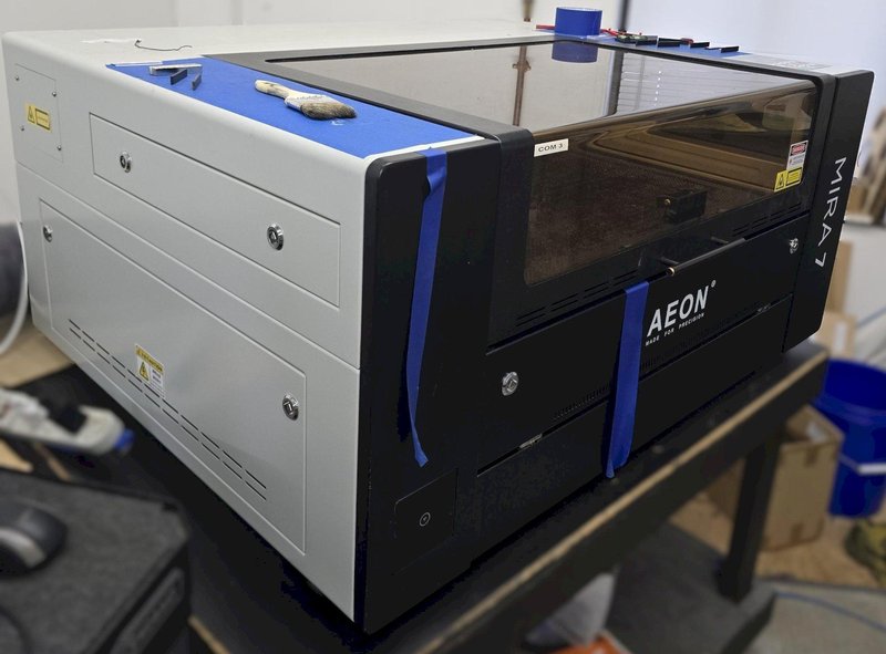 AEON MIRA7 Laser 60w Class 1 CO2 Laser w/Motorized Z Table, Blade Table, 2.0" Focal Lens, Red Dot Beam Combiner, Clean Pack Design, Built-In Air Compressor, Built-In Exhaust Fan, Built-In Water Chiller