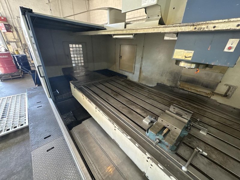 Takumi V32 VMC, 2007 – 4th Axis, CAT50, Box Way, TSC, Chip Conveyor
