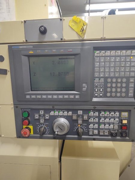 OKUMA Cadet LNC-8C CNC Turning Center, S/N D764, with 10" chuck.