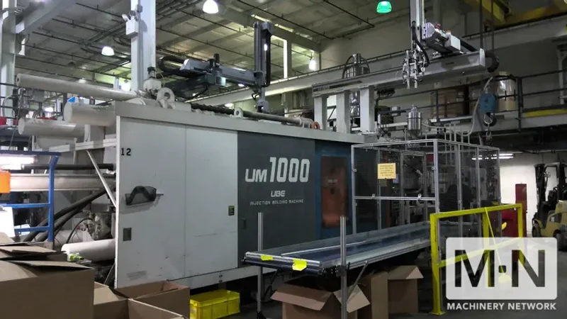 1000 TON 185 OZ UBE MODEL UM1000 INJECTION MOLDING MACHINE MFG 1999