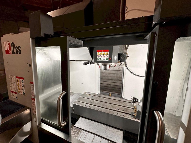 2024 HAAS VF-2SS with HC10 6-Axis Cobot with low hours. Vertical Machining Center