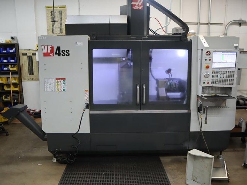 Haas VF-4SS 5-Axis CNC Vertical Machining Center,  12K RPM Spindle, 30 Station SMTC, TSC, Probing, Chip Auger, 4th and 5th Axis Drives with Haas TR-200Y Trunnion Table- NEW 2018- Auction Item