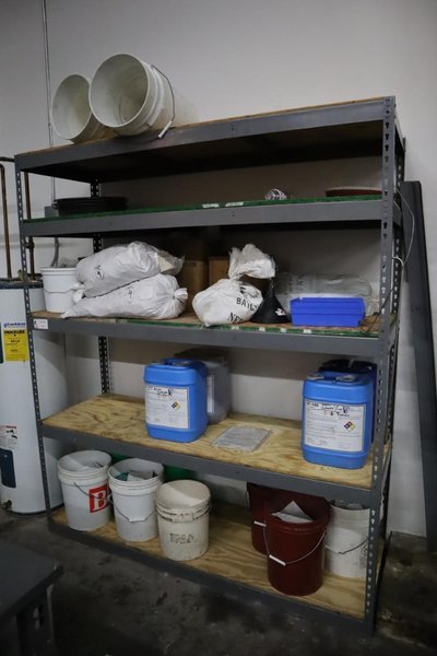 Adjustable Shelving with COntents of Deburring Media and Cleaner- Auction Item