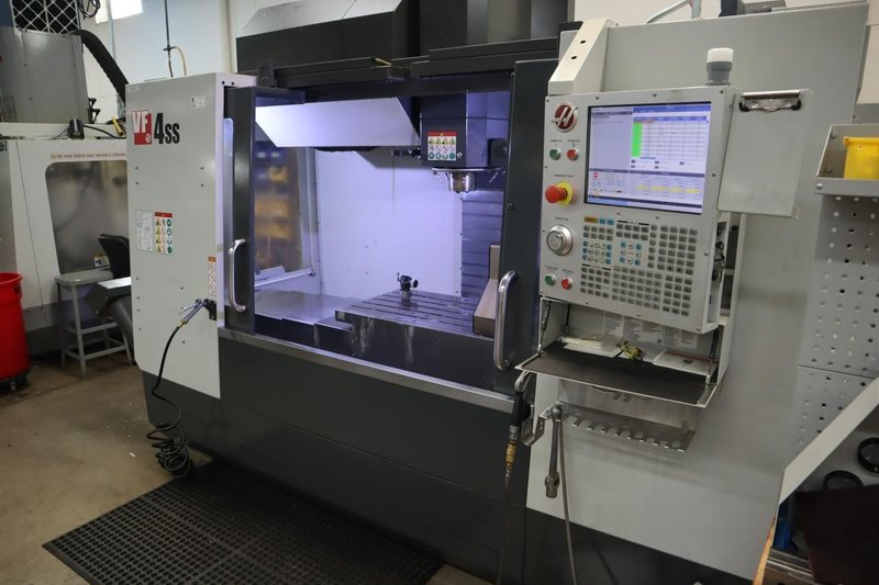 Haas VF-4SS 5-Axis CNC Vertical Machining Center,  12K RPM Spindle, 30 Station SMTC, TSC, Probing, Chip Auger, 4th and 5th Axis Drives with Haas TR-200Y Trunnion Table- NEW 2018- Auction Item