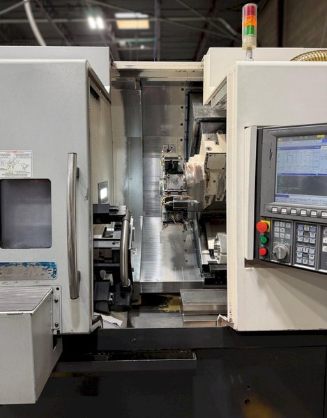 Okuma Genos L-300-MYW-e , 10″ 3-Jaw Kitagawa Chuck Main Spindle, 6″ 3-Jaw Kitagawa Chuck Sub Spindle, Y Axis, 12-Station Live Tool Turret, Tool Presetter, Parts Catcher, Chip Conveyor