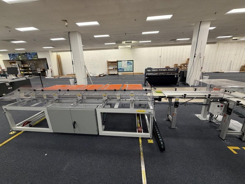 Complete Packaging Line for trays / flat Product including Custom Conveyor System, (2) Texwrap L-Bar Sealers and Heat Tunnels, Econocorp Automatic Cartoner and Case Packer and CTM Case labeler, 2023
