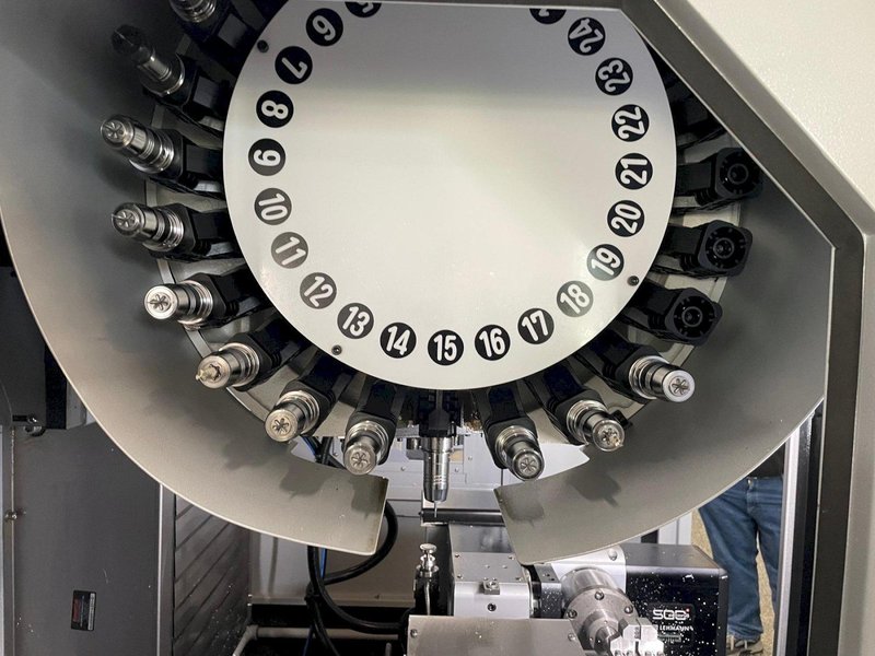 Tornos Almac CU 2007 7-Axis CNC Vertical Machining Center with Part Loading and Parts Catcher System, Probing, 20K Spindle, Lehman 2-Axis Rotary Table, Back Operation Tilting Rotary Vise