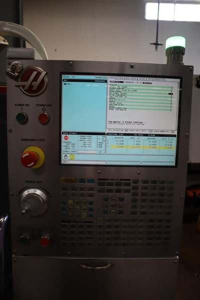 Haas VF-2SS CNC Vertical Machining Center, 12K Spindle, 24 Station SMTC, Probing, TSC, Chip Auger, 4th-Axis Brushless Drive - NEW 2014- Auction Item