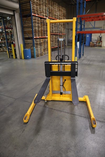 Uline H-5439 Electric Straddle Stacker Lift, 2,200# Cap, 63" Max Height, 50" Between Outriggers, 12 Volt Battery with Charger, 42" Forks- Auction Item