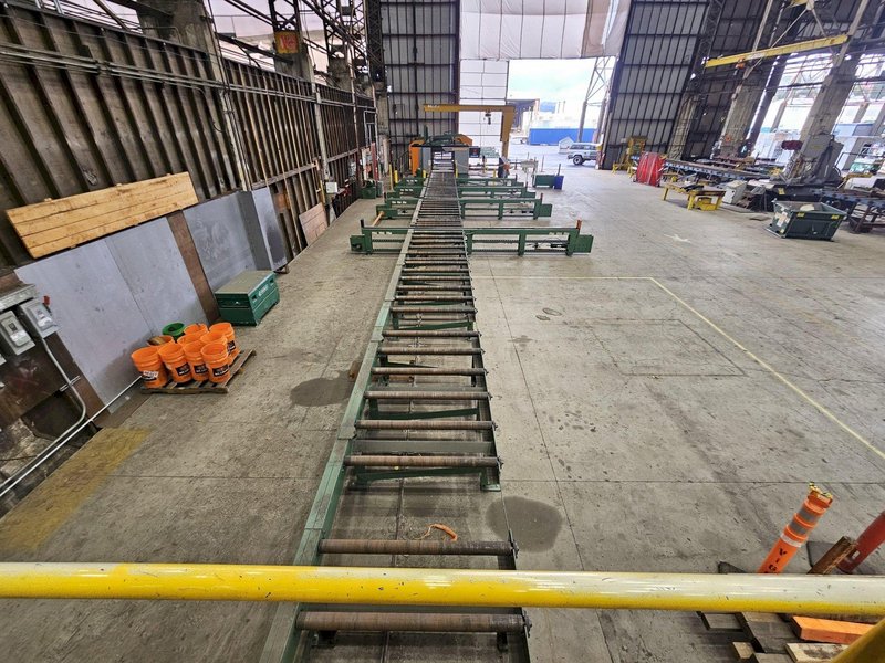 155&#039; X 44&quot; PEDDINGHAUS POWERED MATERIAL CONVEYOR WITH 7 TRANSFER ARMS. CONTROLS/HYDRAULICS INCLUDED. STOCK # 1213825