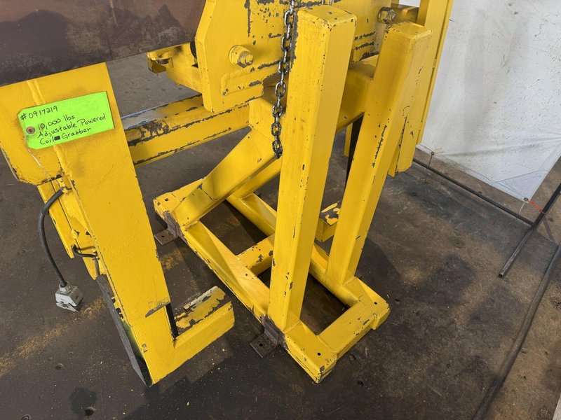 10,000 LBS ADJUSTABLE POWERED COIL GRABBER. STOCK # 0917219
