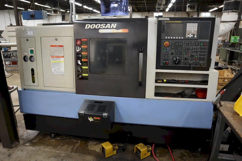 Doosan Lynx 300M CNC Turning Center with Live Milling, 12 Station Turret, 10&quot; 3-Jaw Chuck, Tailstock, Tool Presetter, Parts Catcher, Chip Conveyor- Auction Item
