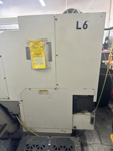 Okuma ES L8 CNC Lathe, 1999 – Tailstock, Chip Conveyor