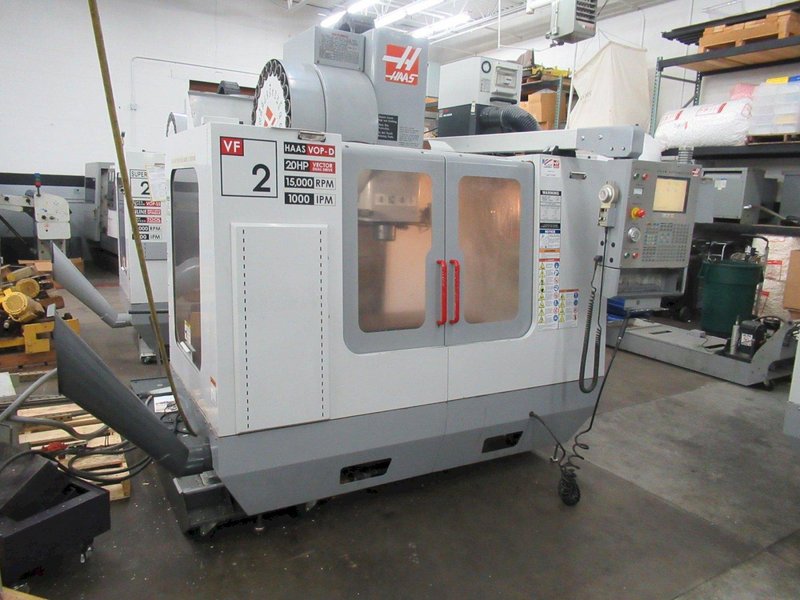 Haas VF-2 CNC Vertical Machining Center with 15,000 RPM CT-40 Spindle, High Speed Machining, Side Mount Tool Changer, 4th Axis Ready, Macros, and Chip Auger.