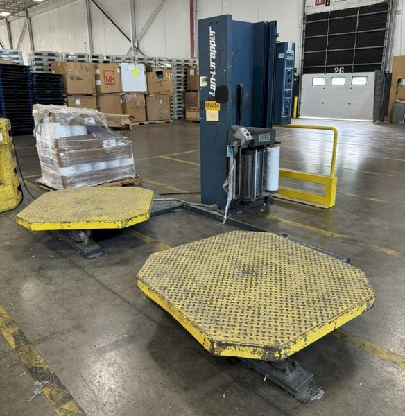 LANTECH V-SERIES DUAL TURNTABLE PALLET WRAPPER. STOCK # 0895024.