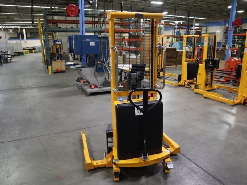 Uline H-2651 Electric Straddle Stacker Lift, 2,200# Cap, 63&quot; Max Height, 50&quot; Between Outriggers, 12 Volt Battery with Charger, 42&quot; Forks- Auction Item