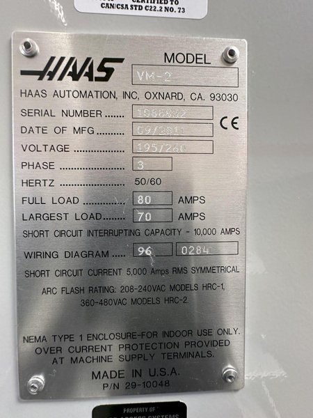 HAAS VM-2 CNC Vertical Machining Center 2011 equipped with quipped with 30"x20"x20" Travels, Haas Control, 4th Axis Drive, 24 ATC Side Mount Tool Changer, Tool Pre-Setter, Cool, Chip Auger