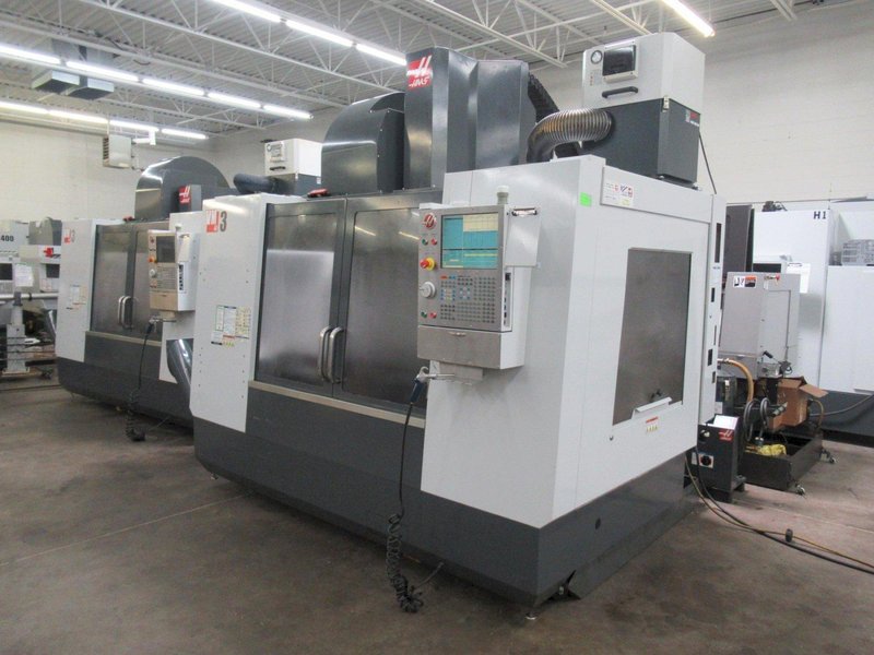 Haas VM-3 CNC Vertical Machining Center with 12,000 RPM CT-40 Spindle, 40 Station Side Mount Tool Changer, Probing, 1000 PSI TSC, High Speed Machining, Mist Collector,  Chip Auger.