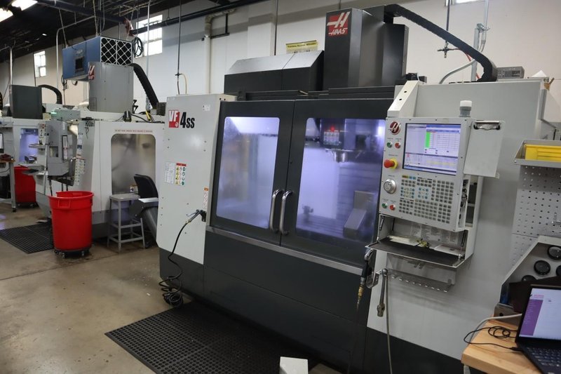 Haas VF-4SS 5-Axis CNC Vertical Machining Center,  12K RPM Spindle, 30 Station SMTC, TSC, Probing, Chip Auger, 4th and 5th Axis Drives with Haas TR-200Y Trunnion Table- NEW 2018- Auction Item